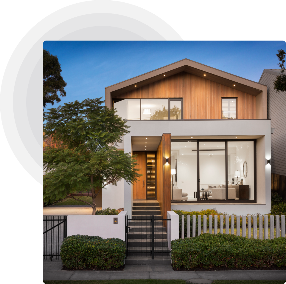 Stylish modern house exterior with a sleek gray background, showcasing contemporary architecture